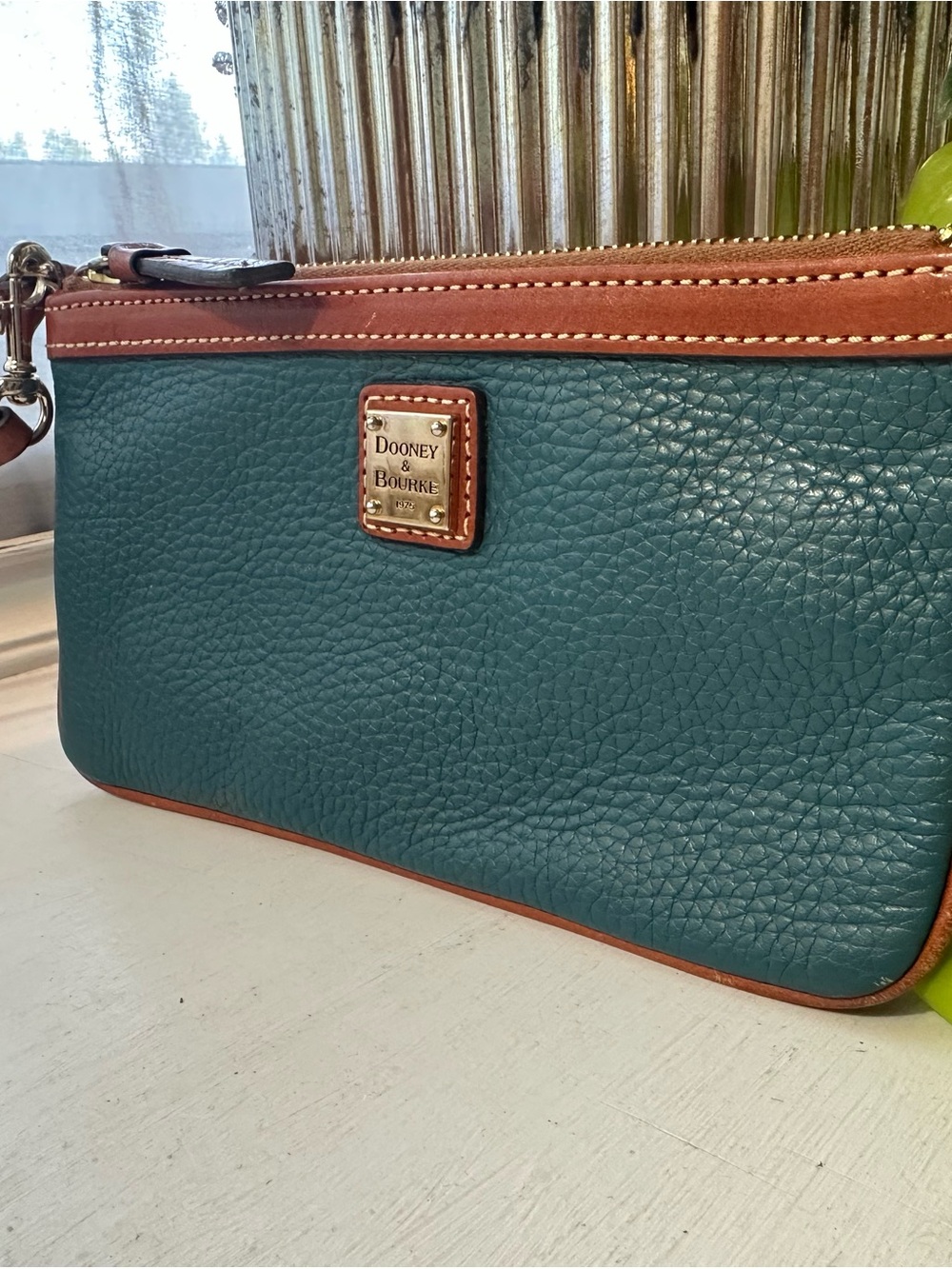 Dooney & Bourke Teal Pebbled Leather Wristlet with Brown Trim